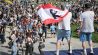 01.05.2025, Berlin: Musiker mit einer abgewandelten Berlin Flagge singen auf einer Bühne im Görlitzer Park. (Quelle: dpa/Hannes P. Albert)